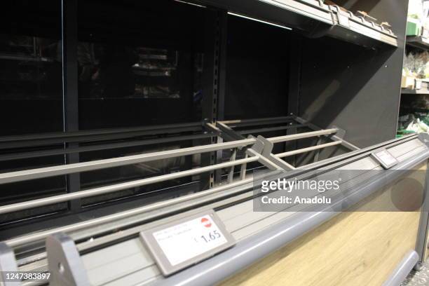 An empty vegetable shelf is seen at a supermarket in London, United Kingdom on February 22, 2023. Supermarkets across Britain are currently seeing...