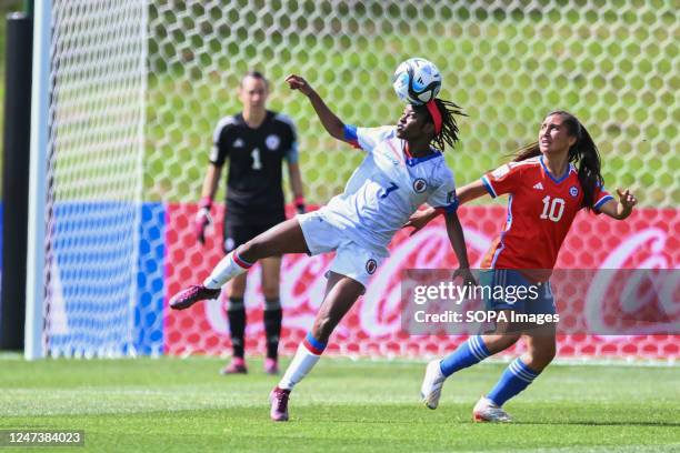 Jennyfer Limage of Haiti National Women's soccer team and Valentina Navarrete of Chile National Women's soccer team were seen in action during the...