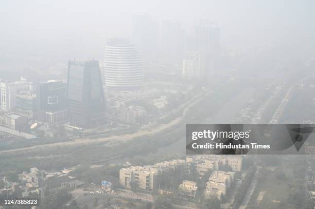 View of city in dense smog amid rising air pollution levels, on February 22, 2023 in Noida, India.