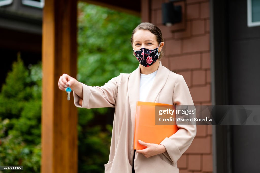 Real Estate Agent with a protective face mask