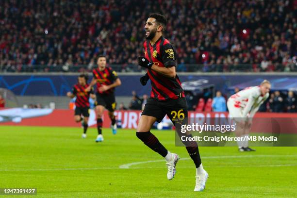 Riyad Mahrez of Manchester City celebrates scoring the opening goal during the UEFA Champions League round of 16 leg one match between RB Leipzig and...