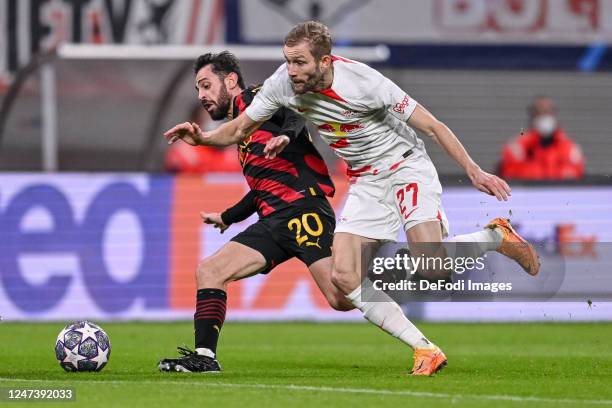 Bernardo Silva of Manchester City and Konrad Laimer of RB Leipzig battle for the ball during the UEFA Champions League round of 16 leg one match...