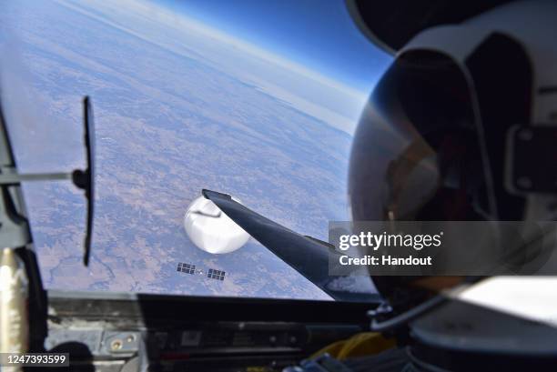 In this handout image provided by the Department of Defense, a U.S. Air Force U-2 pilot looks down at the suspected Chinese surveillance balloon on...