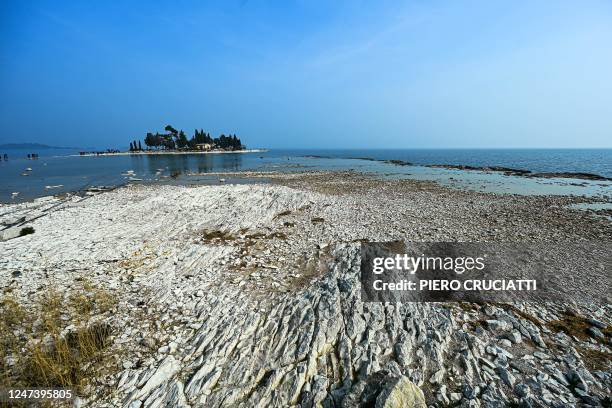 General view of the small island of San Biagio, off Manerba del Garda, Lake Garda, on February 21 where the water level dropped to its lowest in 30...