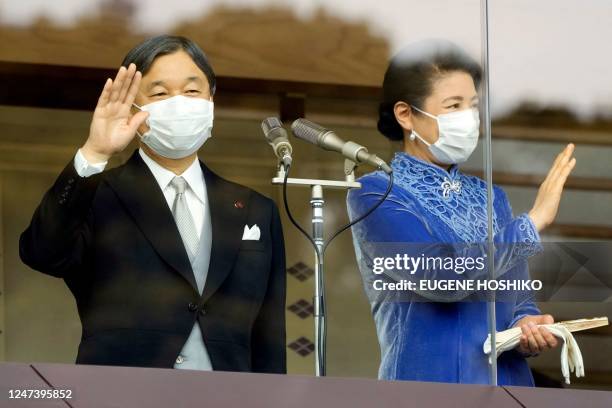 Japanese Emperor Naruhito and Empress Masako greet people during his birthday celebrations at the Imperial Palace in Tokyo on February 23, 2023.