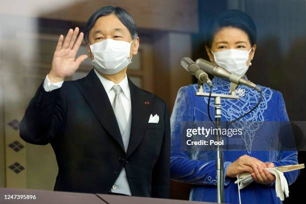 Japan's Emperor Naruhito , accompanied by Empress Masako, waves to well-wishers as he appears on the balcony of the Imperial Palace to mark his 63rd...