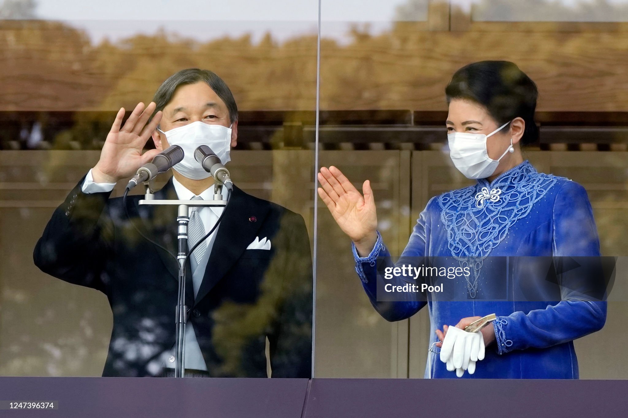 japans-emperor-naruhito-accompanied-by-empress-masako-waves-to-well-wishers-as-he-appears-on.jpg