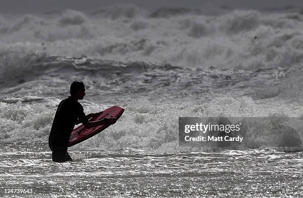 Bodyboarders brave the rough seas at Rhossili Bay in the Gower near Swansea on September 12, 2011 in Wales. Parts of the country are to be hit by...