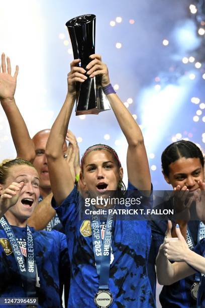 United States forward Alex Morgan raises the SheBelieves Cup trophy as the United States Womens National Soccer Team celebrates following the 2023...