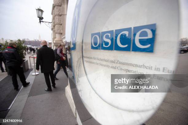The logo of the Organization for Security and Co-operation in Europe is pictured in front of the Hofburg Palace in Vienna, Austria, on February 23,...