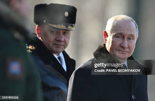 Russian President Vladimir Putin and Russian Defence Minister Sergei Shoigu attend a wreath-laying ceremony at the Eternal Flame and the Unknown...