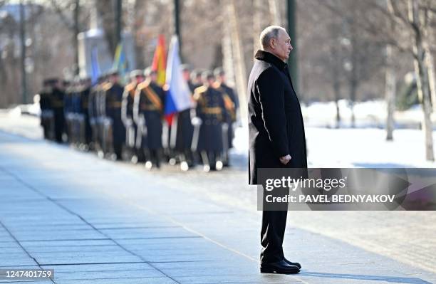 Russian President Vladimir stands during a wreath-laying ceremony at the Eternal Flame and the Unknown Soldier's Grave in Alexander Garden during an...