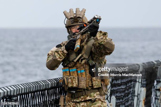 An KSK Navy Special Forces solidor is seen as he exercises on board on the frigate Hessen during the inaugural visit of German Defence Minister Boris...
