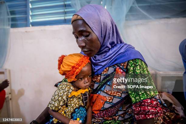 Zouera Saidou is in hospital with her granddaughter, 2-year-old weighing 6.4kg - half the average weight of a child her age, who is also suffering...