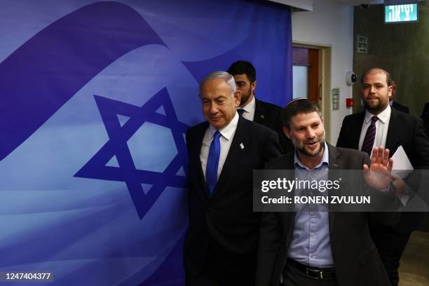 Israeli Prime Minister Benjamin Netanyahu and Finance Minister Bezalel Smotrich arrive to attend a cabinet meeting at the prime minister's office in...