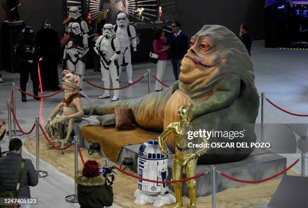 Life-size figures depicting Star Wars saga's characters Jabba the Hutt, C3-PO and R2D2 are pictured on the opening day of the exhibition "Fuenlabrada...