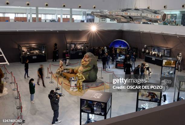 Life-size figures depicting Star Wars saga's characters Jabba the Hutt, C3-PO and R2D2 are pictured on the opening day of the exhibition "Fuenlabrada...