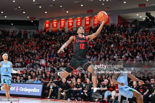 Houston Cougars guard Tramon Mark finishes a lone coast-to-coast fast break layup during the basketball game between the Tulane Green Wave and...