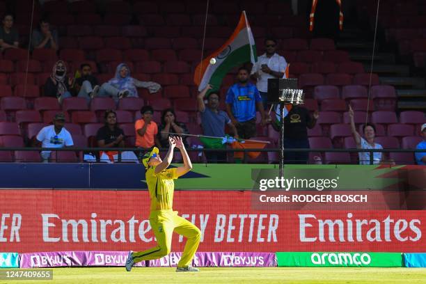 Australia's Tahlia Mcgrath catches the ball dismissing India's Richa Ghosh during the semi-final T20 women's World Cup cricket match between...