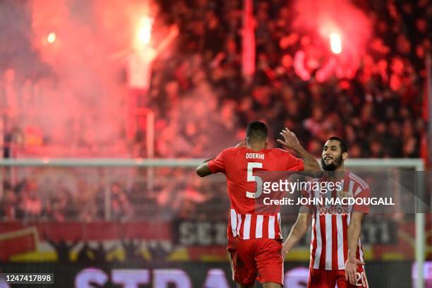 Union Berlin's Dutch defender Danilho Doekhi celebrates scoring the 3-1 goal with his team-mate Union Berlin's Tunisian midfielder Aissa Laidouni...