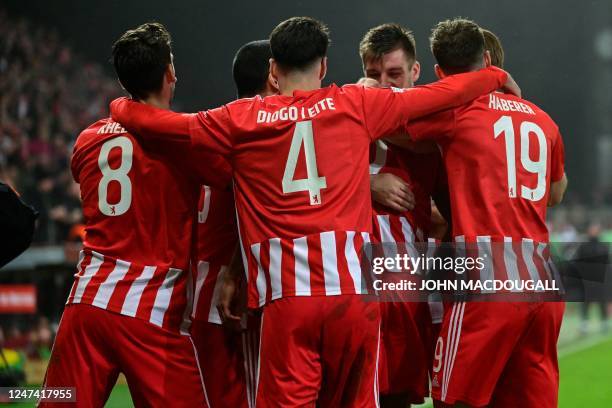 Union Berlin's Dutch defender Danilho Doekhi celebrates scoring the 3-1 goal with his team-mates during the UEFA Europa League play-off 2nd-leg...