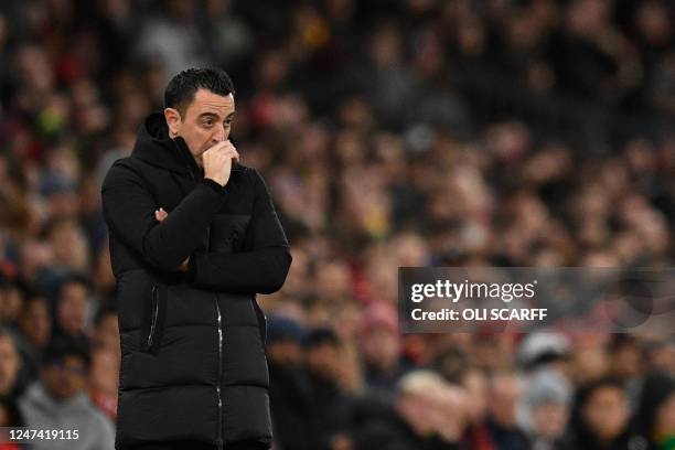 Barcelona's Spanish coach Xavi reacts during the UEFA Europa league knockout round play-off second leg football match between Manchester United and...