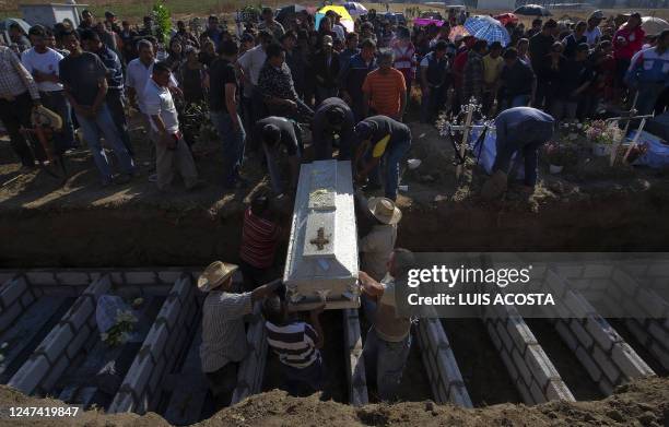 Relatives of the Medel family, killed by the explosion of a Pemex pipeline, attend their funeral in Texmelucan, Puebla state, Mexico, on December 20,...