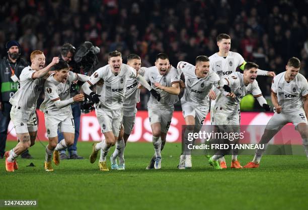 Shakhtar's players celebrate as they win in a penalty shoot-out after the UEFA Europa League play-off second-leg football match between Stade Rennais...