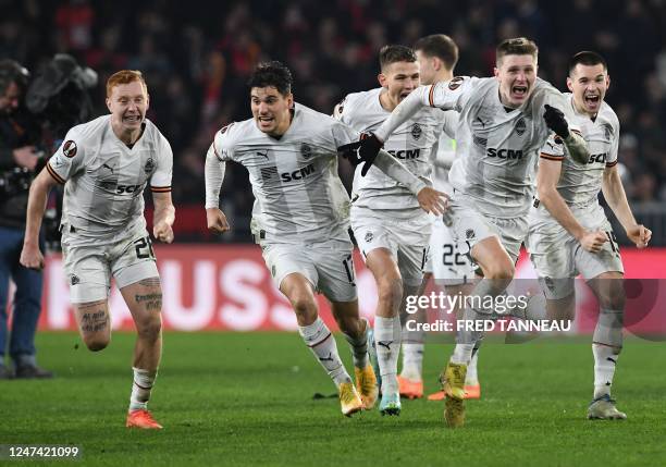 Shakhtar's players celebrate as they win in a penalty shoot-out after the UEFA Europa League play-off second-leg football match between Stade Rennais...