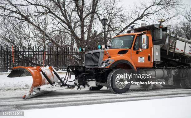 Snow plow clears a street after a winter storm on February 23, 2023 in St. Paul, Minnesota. A winter storm has caused major travel disruption across...