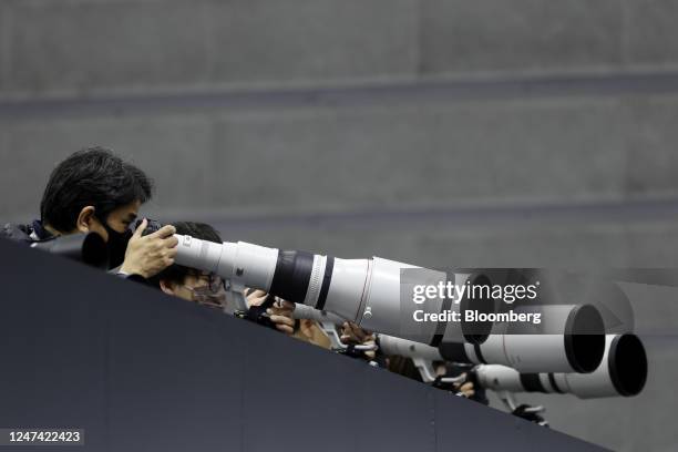 Attendees try out Canon Inc. Super telephoto prime lenses at the CP+ Camera and Photo Imaging Show in Yokohama, Japan, on Thursday, Feb. 23, 2023....