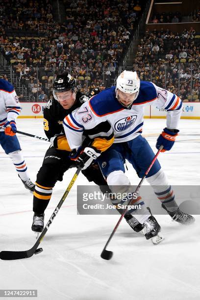 Brock McGinn of the Pittsburgh Penguins battles against the Edmonton Oilers at PPG PAINTS Arena on February 23, 2023 in Pittsburgh, Pennsylvania.