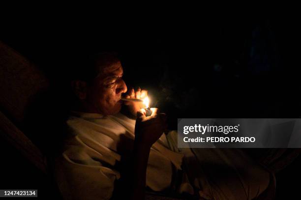 Miguel Payaguaje, healer of the indigenous Siekopai ethnic group , smokes while getting ready for a Yage drinking ceremony in Lagartococha, Mañoco,...