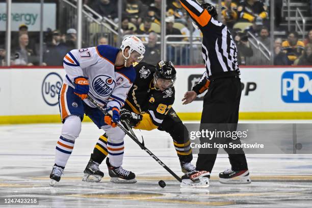 Edmonton Oilers Center Connor McDavid and Pittsburgh Penguins Center Sidney Crosby face-off during the first period in the NHL game between the...