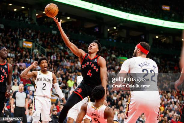Scottie Barnes of the Toronto Raptors drives to the net against Herbert Jones of the New Orleans Pelicans during the first half of their NBA game at...