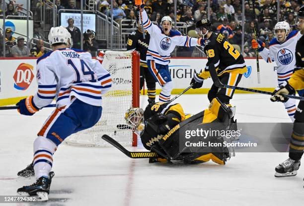 Edmonton Oilers Center Devin Shore scores a goal past Pittsburgh Penguins Goalie Tristan Jarry during the second period in the NHL game between the...