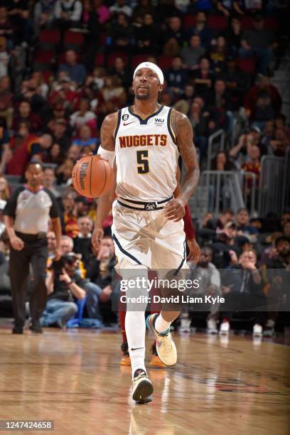 Kentavious Caldwell-Pope of the Denver Nuggets dribbles the ball during the game against the Cleveland Cavaliers on February 23, 2023 at Rocket...