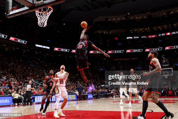 Chris Boucher of the Toronto Raptors dunks the ball against the New Orleans Pelicans on February 23, 2023 at the Scotiabank Arena in Toronto,...