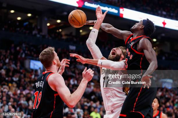 Pascal Siakam of the Toronto Raptors knocks the ball away from Jonas Valanciunas of the New Orleans Pelicans as he goes up for a shot during the...