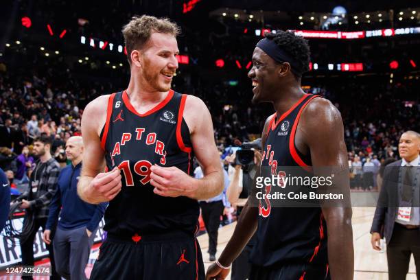 Jakob Poeltl and Pascal Siakam of the Toronto Raptors celebrate after their NBA game against the New Orleans Pelicans at Scotiabank Arena on February...