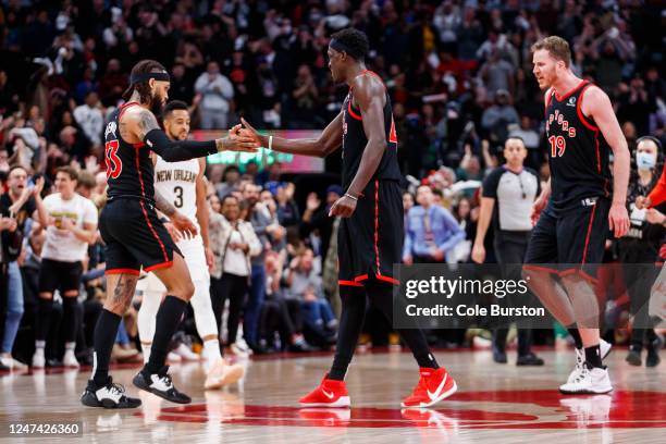 Gary Trent Jr. #33 of the Toronto Raptors and Pascal Siakam celebrate Trent Jr.'s basket against the New Orleans Pelicans during the second half of...