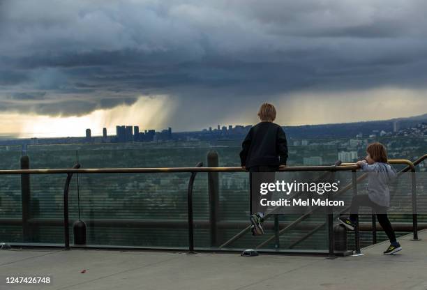 Gus Bolton left, and his brother Darcy take in the view from the Griffith Observatory in Los Angeles on Thursday afternoon. They are from Manhattan...