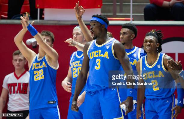 Adem Bona, Dylan Andrews, Jake Seidler, Logan Cremonesi and Abramo Canka of the UCLA Bruins cheer from the bench during the second half of their game...