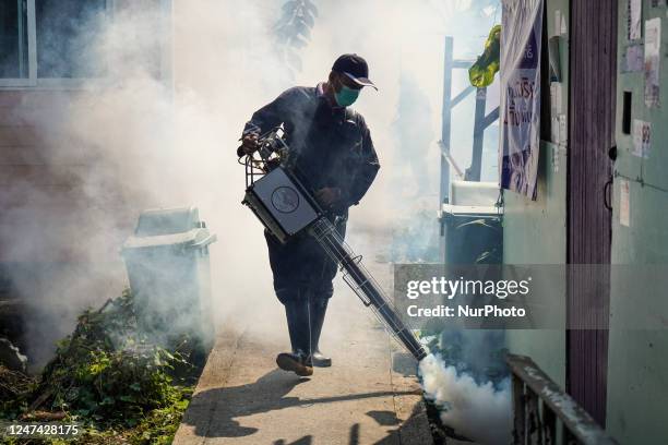 Thai health officer sprays chemicals to kill mosquitos for the health precaution against dengue fever inside a community in Bangkok, Thailand, 24...