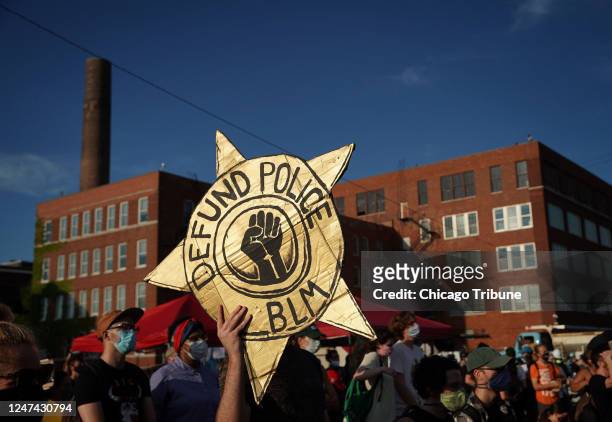 Black-led groups lead a rally to defund police across from the Chicago Police Department&apos;s Homan Square facility, July 24, 2020.
