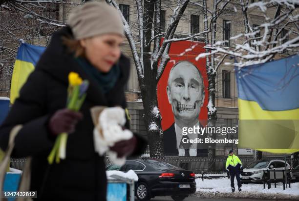 Mural depicting Vladimir Putin, Russia's President, on a building adjacent to the Russian embassy, in Riga, Latvia, on Friday, Feb. 24, 2023. Russias...