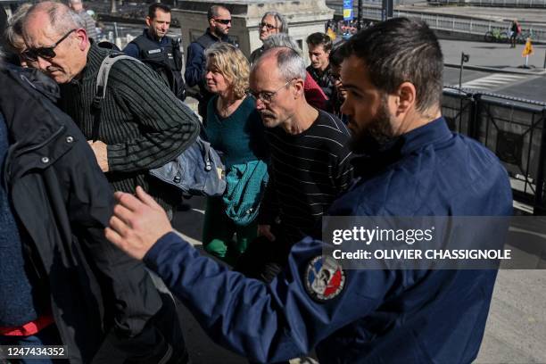 Italian anti-globalization activist Vincenzo Vecchi arrives at a courthouse in Lyon, south-eastern France on February 24, 2023. - France's "Cour de...
