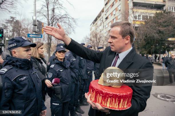 Serbian police prevent activists from reaching the Russian embassy building during a rally to mark the one-year anniversary of Russia's invasion of...