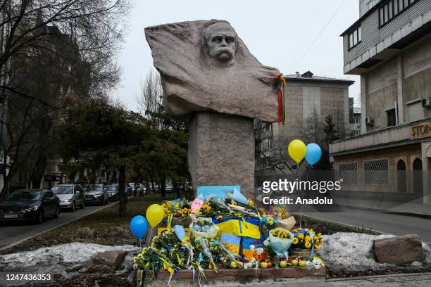 Kazakh people lay flowers at the monument to Taras Shevchenko in honor of the anniversary of the war between Russia and Ukraine in Almaty, Kazakhstan...