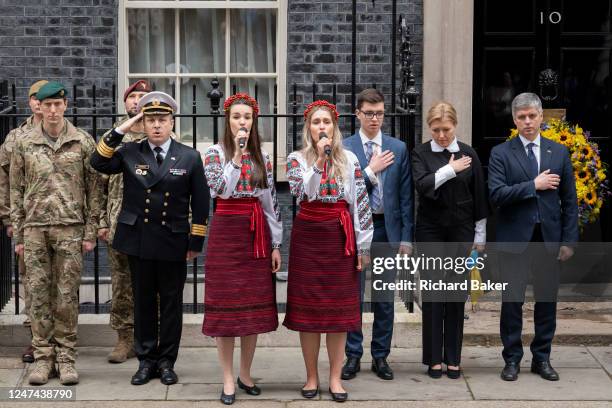 On the first anniversary of Ukraine's war with Russia, its Defence Attache Defence to London, Dmytro Donskoi sings the national anthem outside...